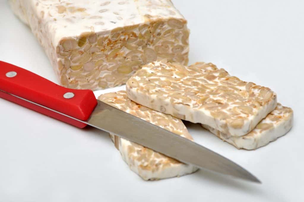 Tempeh is a traditional soy product originally from Indonesia. It is made by a natural culturing and controlled fermentation process that binds soybeans into a cake form