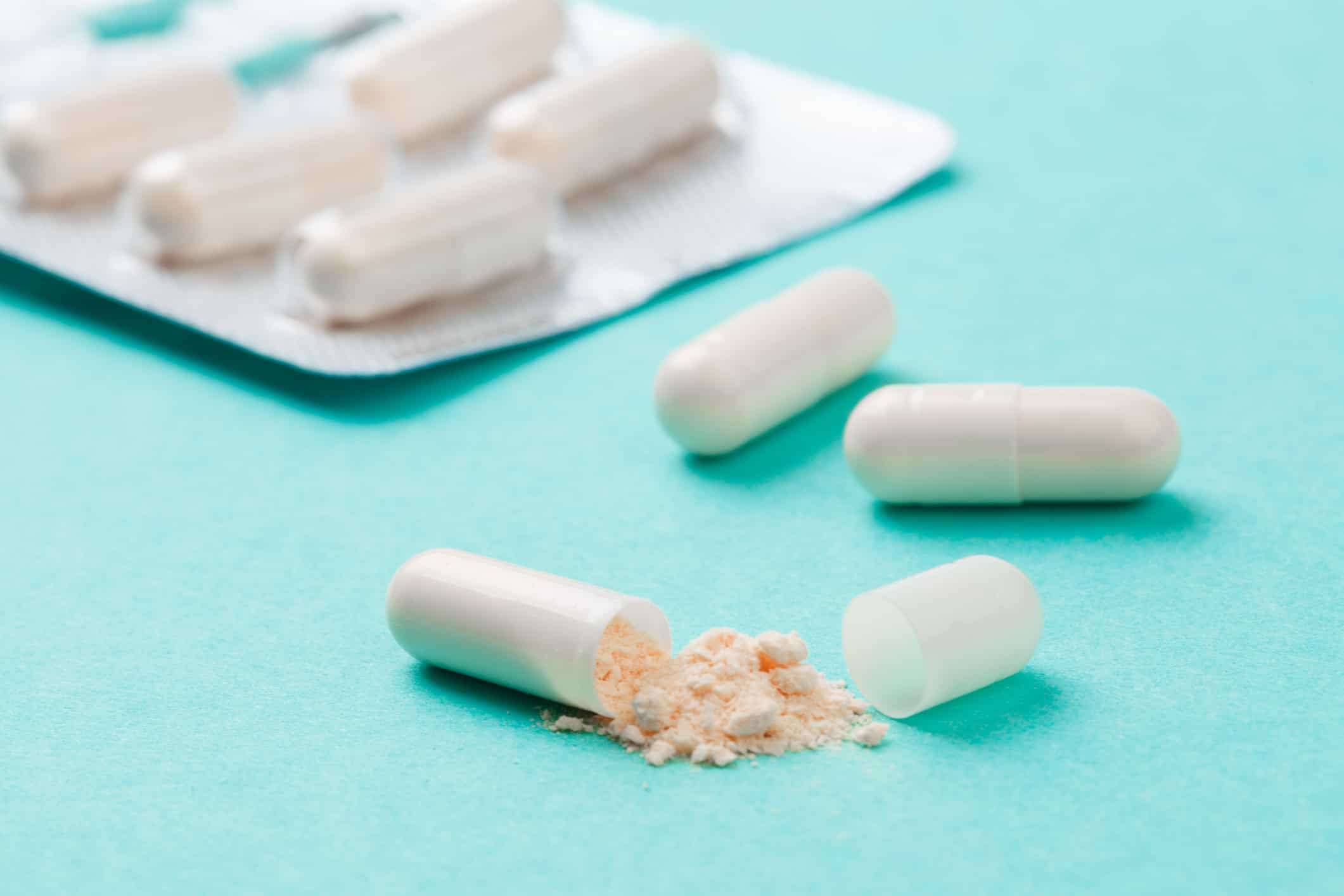 White medicine capsules probiotic powder inside and whether you take a probiotic every day