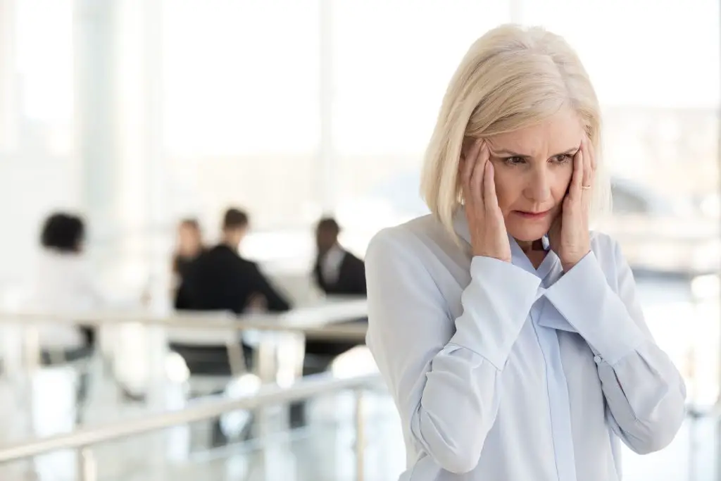 Woman suffering from a headache caused by a hormonal imbalance