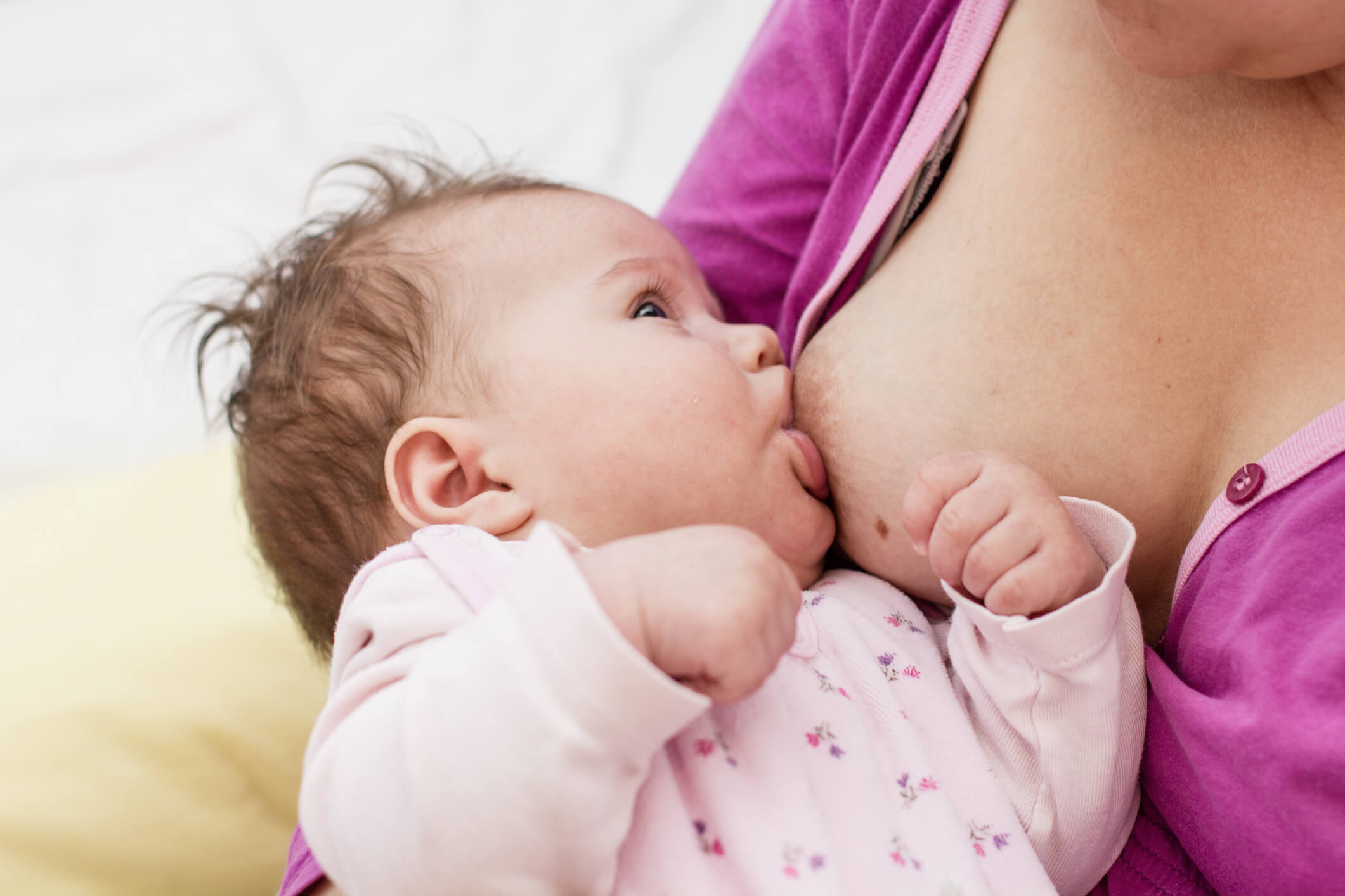 Mom feeding baby and consuming probiotics too